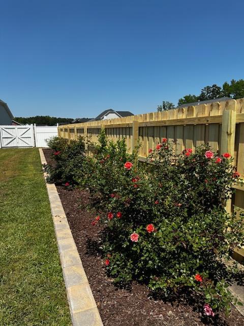 Enhancing Privacy and Peace: Our Specialty Fence Solution for a Happy Client in Raeford, NC